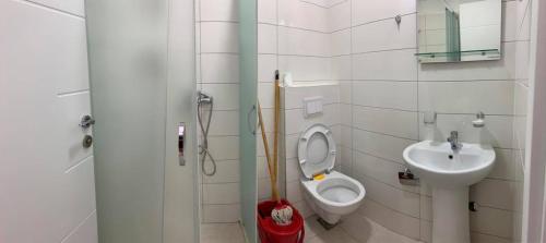a bathroom with a toilet and a sink at Jelić apartmani in Sutomore