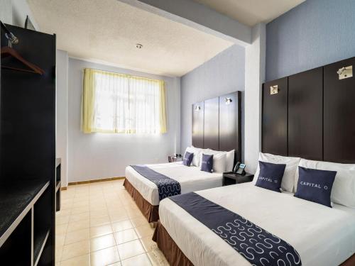 Tempat tidur dalam kamar di Hotel Spa Shalam