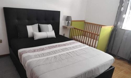 Ένα ή περισσότερα κρεβάτια σε δωμάτιο στο Casa Manos Névoa