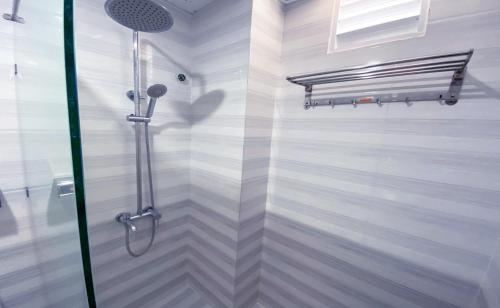 a shower with a glass door in a bathroom at Thiên Hải 2 Hotel in Quy Nhon
