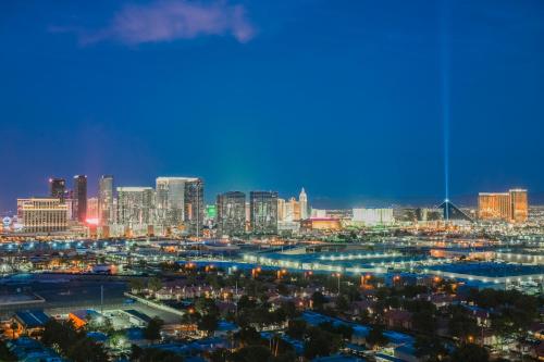 a view of a city skyline at night at StripViewSuites Two-Bedroom Conjoined Suite at Palms Place in Las Vegas