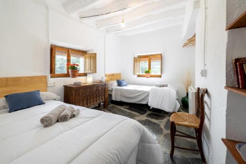 En eller flere senge i et værelse på Casa rural El Fuerte de Atabuey
