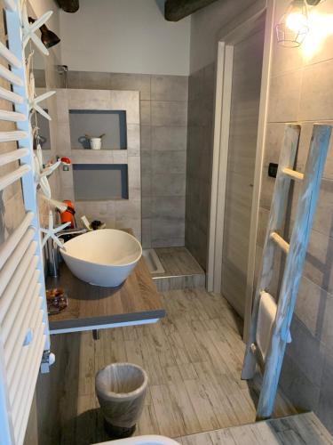 a bathroom with a bowl sink and a shower at Villa Anna GuestHouse in Brindisi