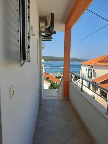 a balcony with a view of the water at Apartment Čiovo Radić in Trogir