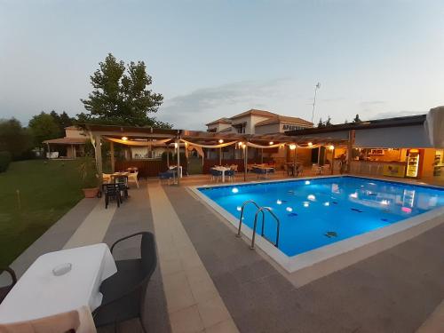 a swimming pool in the backyard of a house at Alea Villas in Kourouta