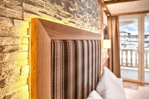 Postel nebo postele na pokoji v ubytování Hotel & Appartements Heigenhauser