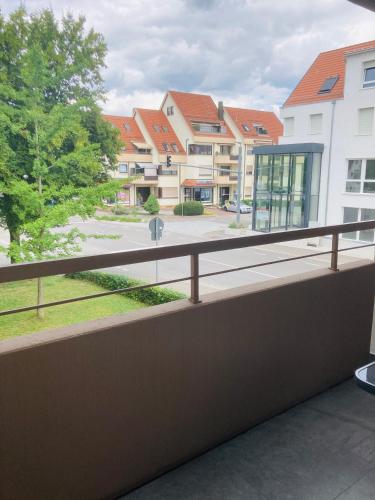 a balcony with a view of some buildings at L-DOM in Metzingen