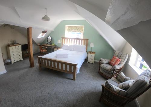 En eller flere senger på et rom på Underhill Guest House
