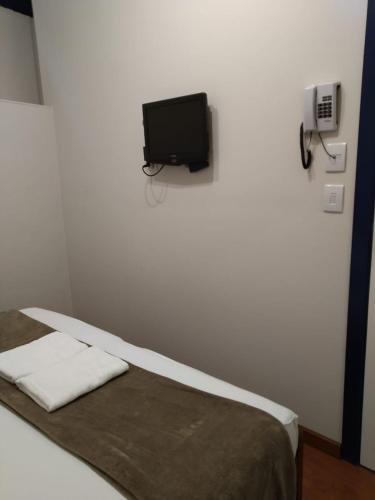 Postel nebo postele na pokoji v ubytování Hotel Barroco Mineiro