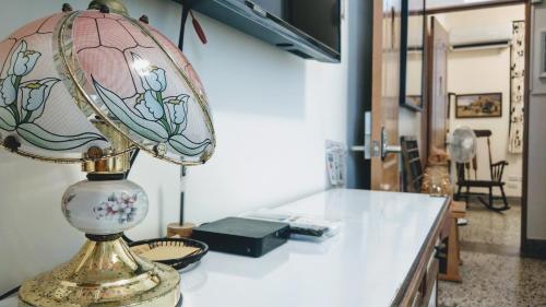a lamp sitting on a counter in a room at 赤嵌厝Child Come Home in Tainan