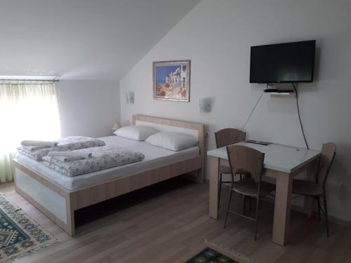Ένα ή περισσότερα κρεβάτια σε δωμάτιο στο Apartments City Paradise