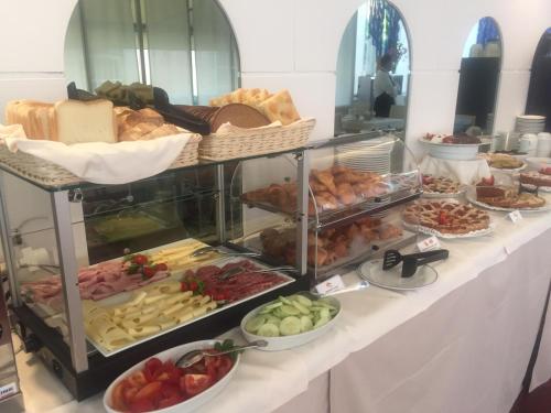 a buffet line with many different types of food at Hotel Morandi in Sanremo