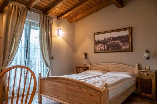 En eller flere senge i et værelse på Agriturismo La Zangola