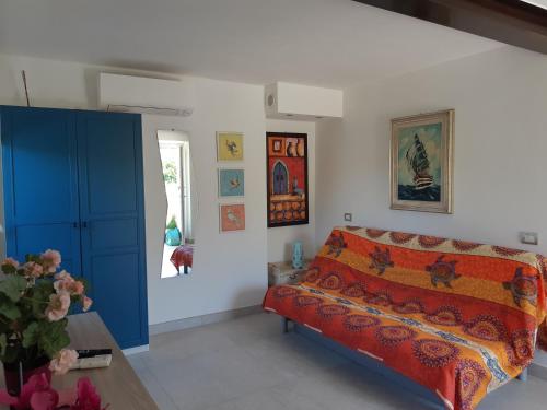 a bedroom with a bed and a blue cabinet at Casa Isabelle Mel in La Spezia