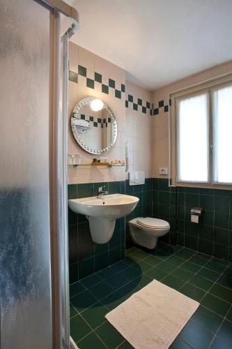 a bathroom with a sink and a toilet at Santanna in Verbania