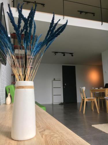 a white vase sitting on top of a table at 2Stories Empire Duplex at Damansara Perdana in Damansara Perdana