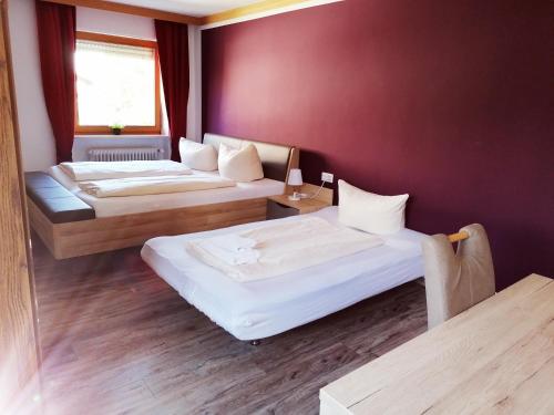 Postel nebo postele na pokoji v ubytování Hotel Oyer Hof - selbst Service