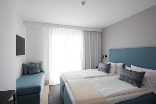 Ένα ή περισσότερα κρεβάτια σε δωμάτιο στο Hotel Tahiti