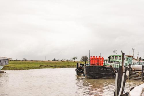 a boat is docked in a body of water at Customs House by Bloom Stays in Faversham