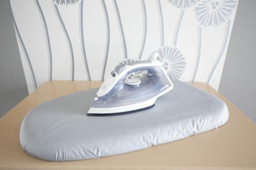 a cake with a phone on top of a pillow at SUMIYOSHI APARTMENT Hotel 住吉アパートメントホテル in Fukuoka