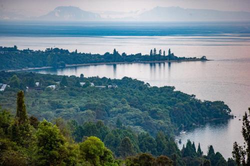 an island in the middle of a large body of water at Tongariro Adventures The Lodge in Kuratau