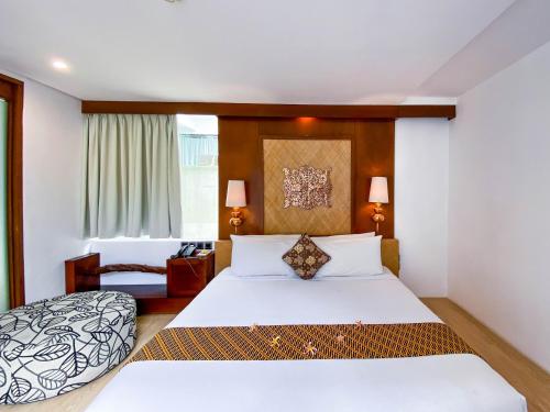 Ένα ή περισσότερα κρεβάτια σε δωμάτιο στο Puri Hiromi Boutique Residence