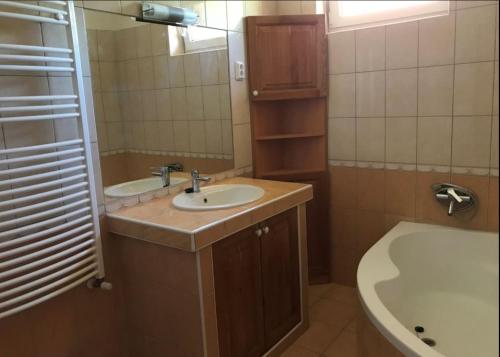 Kúpeľňa v ubytovaní Panoráma Apartman Ház