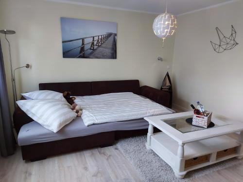 a bedroom with a bed with a teddy bear on it at Schöne Maid in Boppard