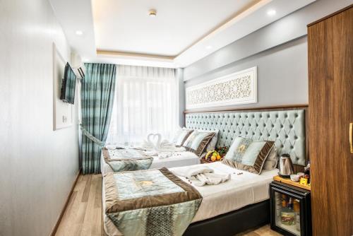מיטה או מיטות בחדר ב-Istanbul Sirkeci Hotel