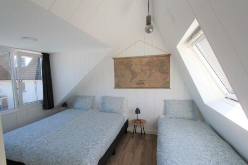 מיטה או מיטות בחדר ב-Beaufort