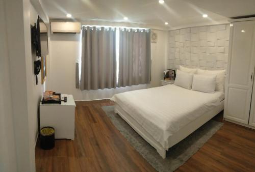 Katil atau katil-katil dalam bilik di Galaxy Hotel