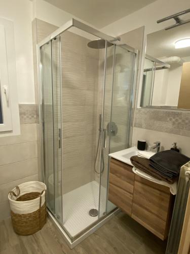 a bathroom with a glass shower and a sink at Clotes modern apartment, 50m from slopes - sleeps 6-8, 2 bath - SauzeHoliday in Sauze dʼOulx