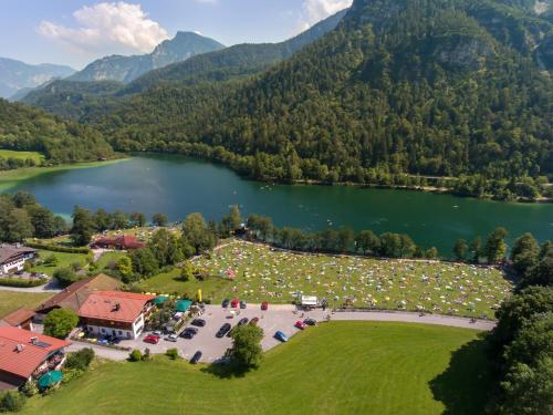 an aerial view of a park next to a lake at Alpengasthof Madlbauer in Bad Reichenhall