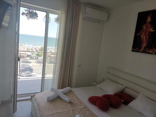 Ένα ή περισσότερα κρεβάτια σε δωμάτιο στο MaraVali beach apartment