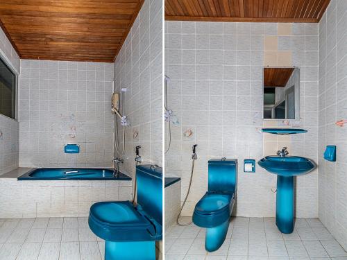 Ein Badezimmer in der Unterkunft OYO 89864 Hotel Holiday Park