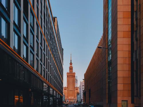 a view of the big ben clock tower between buildings at PURO Warszawa Centrum in Warsaw