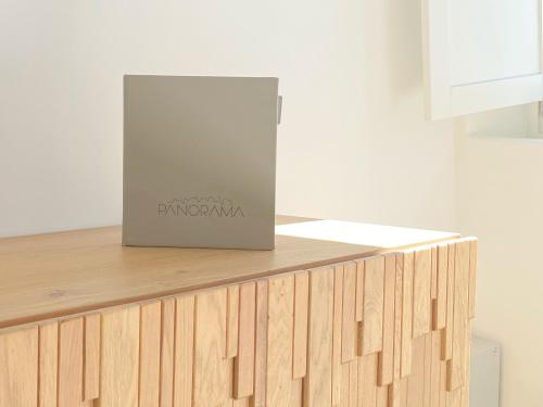 a box sitting on top of a wooden counter at Panorama Suites in Fira