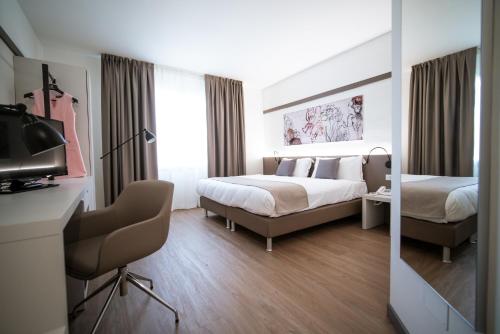 Кровать или кровати в номере Bonotto Hotel Palladio