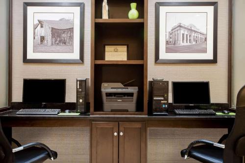 an office with two computers and a printer on a desk at La Quinta by Wyndham Lynchburg at Liberty Univ. in Lynchburg