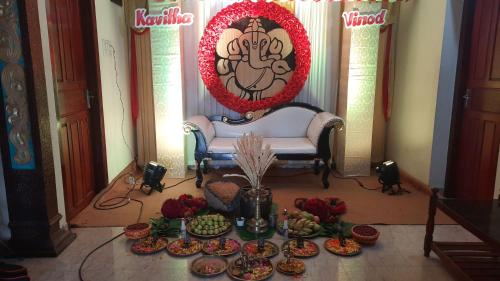 a table filled with plates of food in a room at Krishnendu Homestay outer ring road north nada guruvayur in Guruvāyūr