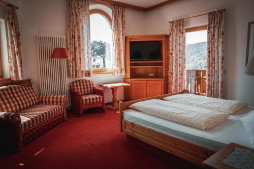 Postel nebo postele na pokoji v ubytování Hotel Sonnenhof