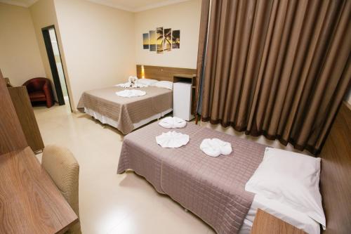 מיטה או מיטות בחדר ב-Hotel Vitoria