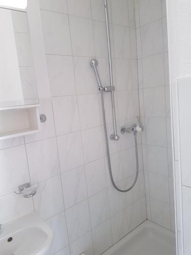 a bathroom with a shower and a sink at Chesa Madrisa in St. Moritz