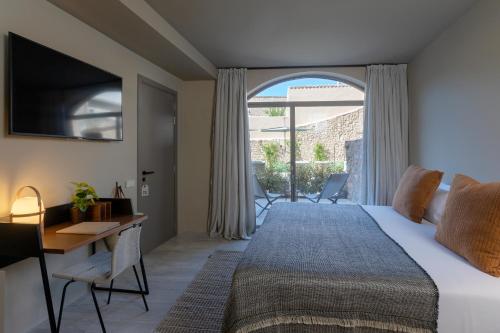 A bed or beds in a room at Can Aulí Luxury Retreat - Adults Only