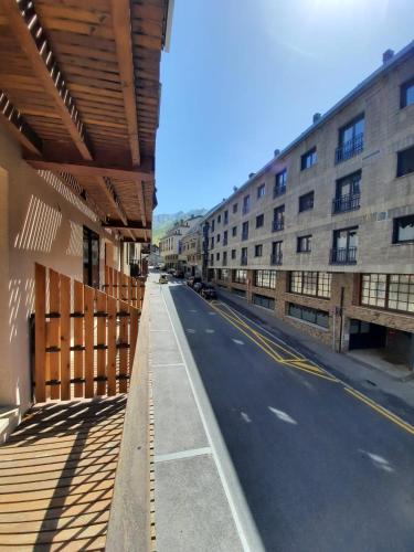 an empty street next to a large building at Altissim Nevada II in Pas de la Casa