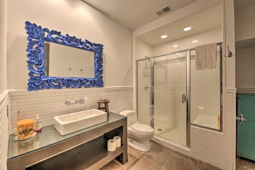 a bathroom with a sink and a toilet and a mirror at Luxe Barndominium with Home Gym, Theater, and More! in Walworth