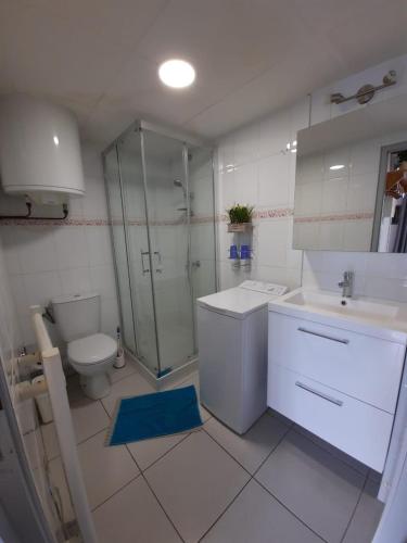 a bathroom with a toilet and a sink and a shower at Altissim Nevada II in Pas de la Casa