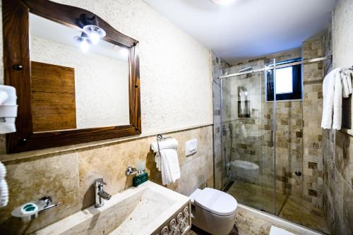 a bathroom with a sink and a toilet and a shower at Stara Čaršija Hotel & SPA in Bar