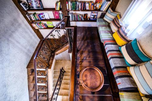 an overhead view of a staircase with bookshelves at Stara Čaršija Hotel & SPA in Bar