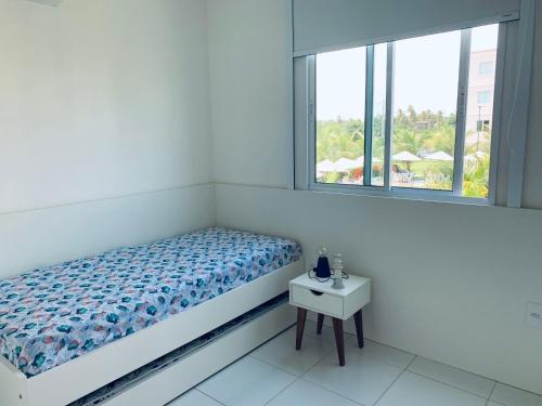 Uma cama ou camas num quarto em RESORT PALM VILLAGE - Muro ALTO, Porto DE GALINHAS